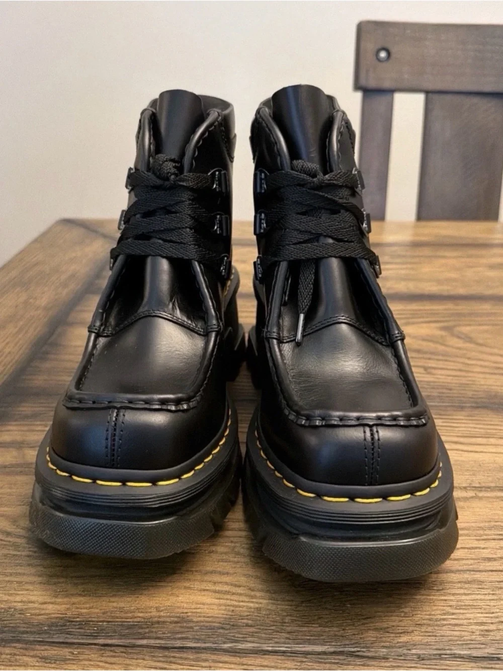 Dr. Martens Black Leather Lug-Sole Ankle Boots with Yellow Stitching